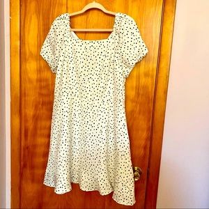 White dress with black polka dots with open back